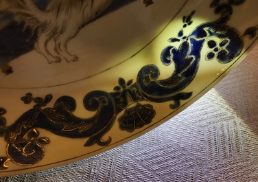 A pair of Chinese Pronk studio eggshell plates with parrots on a perch, Yongzheng/Qianlong