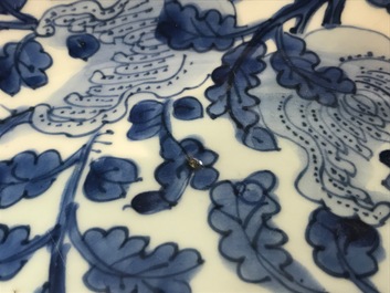 A Chinese blue and white dish with sanduo fruits among foliage, Kangxi