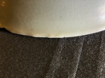 A Chinese incised qingbai foliate bowl with underglaze floral design, Song