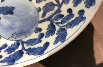 A Chinese blue and white dish with sanduo fruits among foliage, Kangxi