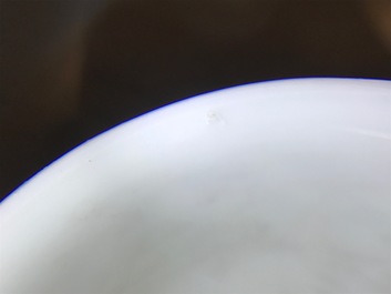 A Chinese famille rose cup and saucer, Yongzheng/Qianlong