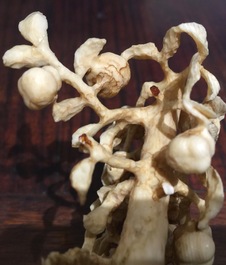 Two Chinese carved ivory groups on wooden base, 2nd quarter 20th C.