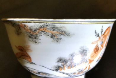 A Chinese anhua decorated cup and saucer with polychrome deer design, Yongzheng