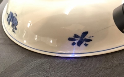 A Chinese blue and white dish with sanduo fruits among foliage, Kangxi