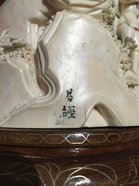 Two Chinese carved ivory groups on wooden base, 2nd quarter 20th C.