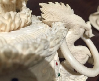 A Chinese encrusted ivory vase on wooden stand, early 20th C.