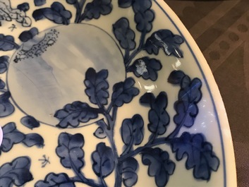 A Chinese blue and white dish with sanduo fruits among foliage, Kangxi