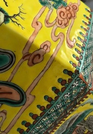 A pair of Chinese hexagonal famille verte yellow-ground vases and covers, 19th C.