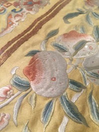A Chinese embroidered yellow-ground silk cloth with peaches, Qing