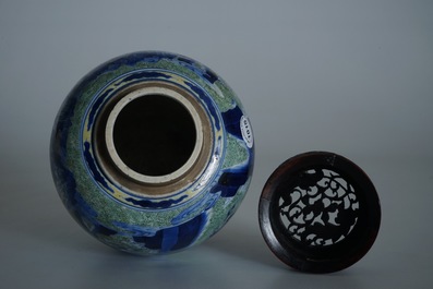 A Chinese famille verte jar with wooden cover and stand, Kangxi