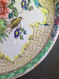 A Chinese famille rose cup and saucer with an insect on sanduo fruit, Yongzheng