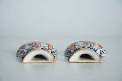 A pair of Chinese famille rose wall vases with figural design, 19th C.