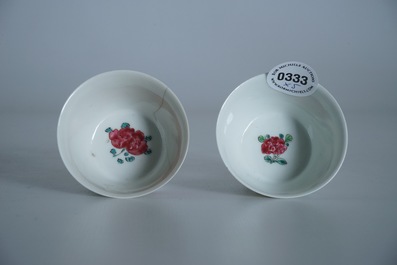 Two Chinese famille rose cups and three saucers with floral design, Yongzheng/Qianlong