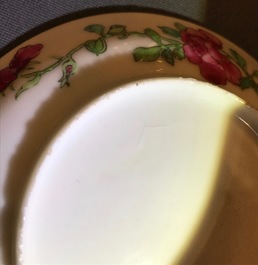 A Chinese famille rose cup and saucer with an insect on sanduo fruit, Yongzheng