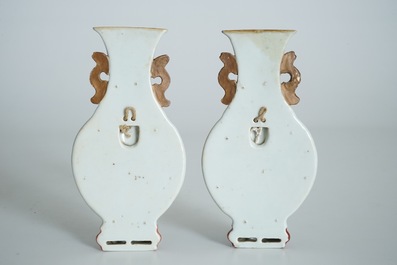 A pair of Chinese famille rose wall vases with figural design, 19th C.