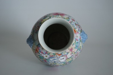 A Chinese famille rose millefleurs hu vase, Qianlong mark, 19/20th C.