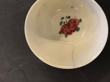 Two Chinese famille rose cups and three saucers with floral design, Yongzheng/Qianlong