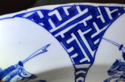 A Chinese blue and white charger with fighting warriors on horseback, Chenghua mark, Kangxi
