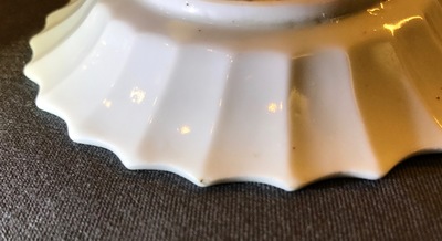 A Chinese lobed famille rose cup and saucer, Yongzheng