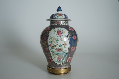 A Chinese bronze-mounted famille rose on blue-ground baluster vase and cover, Yongzheng