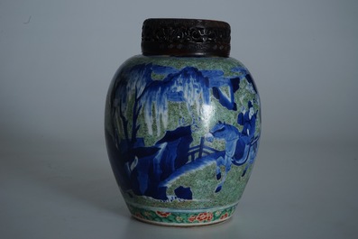 A Chinese famille verte jar with wooden cover and stand, Kangxi