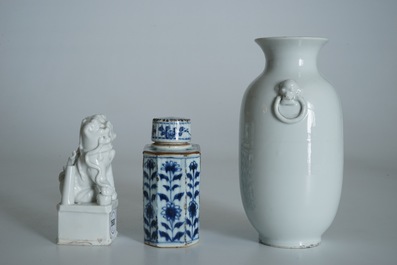A Chinese Dehua blanc de Chine temple lion, a vase and a blue and white tea caddy, Kangxi and later