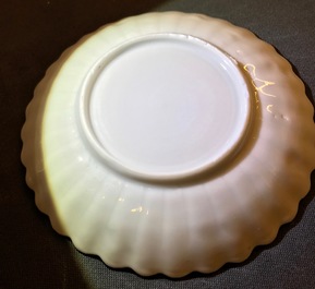 A pair of Chinese lobed famille rose cups and saucers with Magu, Yongzheng