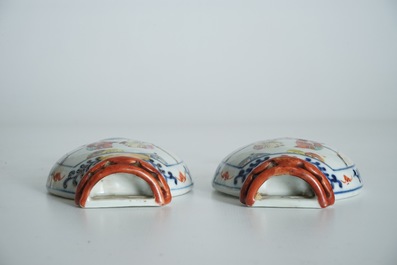 A pair of Chinese famille rose wall vases with figural design, 19th C.