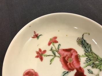 Two Chinese famille rose cups and three saucers with floral design, Yongzheng/Qianlong