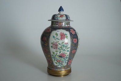 A Chinese bronze-mounted famille rose on blue-ground baluster vase and cover, Yongzheng