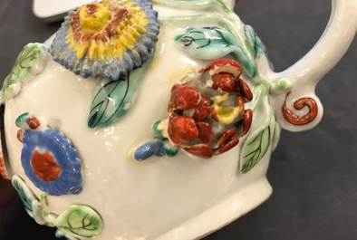 A Chinese famille rose teapot on stand with applied decoration, Yonzheng