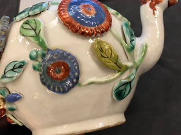 A Chinese famille rose teapot on stand with applied decoration, Yonzheng