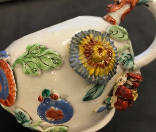 A Chinese famille rose teapot on stand with applied decoration, Yonzheng