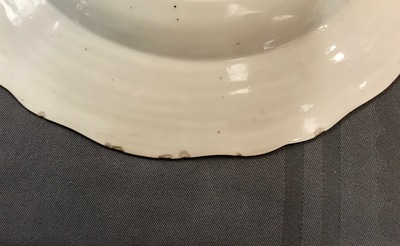 A Chinese export porcelain plate with a fine central scene, Qianlong