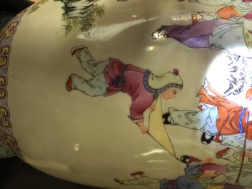 Two tall Chinese famille rose vases with playing boys and court scenes, 19th and 20th C.