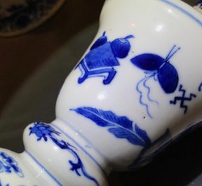 Two pairs of Chinese blue and white candlesticks with dragons, 19/20th C.