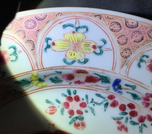 A pair of Chinese famille rose plates with a Dutch nobleman, Qianlong