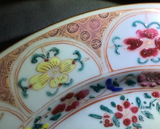 A pair of Chinese famille rose plates with a Dutch nobleman, Qianlong