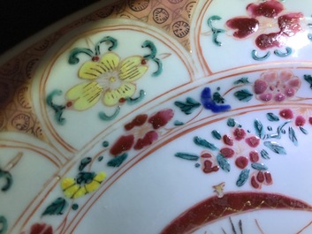 A pair of Chinese famille rose plates with a Dutch nobleman, Qianlong