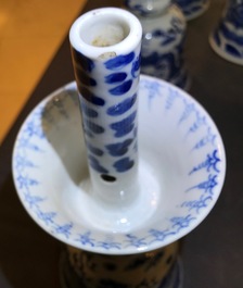 Two pairs of Chinese blue and white candlesticks with dragons, 19/20th C.
