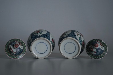 A pair of Chinese famille rose vases and covers, 19th C., and a pair of blue and white dishes, 20th C.