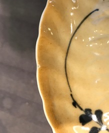 Three Chinese blue and white and caf&eacute; au lait-glazed cups and saucers, Kangxi