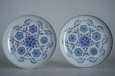 A pair of Chinese famille rose vases and covers, 19th C., and a pair of blue and white dishes, 20th C.