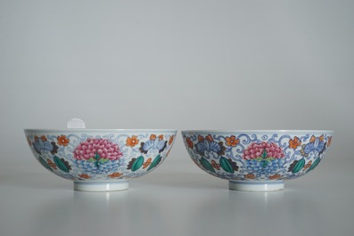A pair of Chinese doucai bowls with floral famille rose medallions, 4-character mark, 19/20th C.
