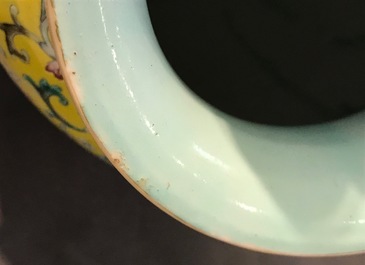 A Chinese yellow-ground famille rose vase, Qianlong mark, 19/20th C.