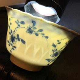 Three Chinese blue and white and caf&eacute; au lait-glazed cups and saucers, Kangxi