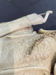 A pair of Chinese ivory warriors on horseback on wooden bases, 19th C.