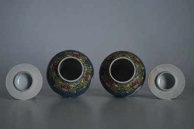 A pair of Chinese famille rose vases and covers, 19th C., and a pair of blue and white dishes, 20th C.