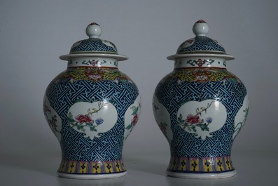 A pair of Chinese famille rose vases and covers, 19th C., and a pair of blue and white dishes, 20th C.