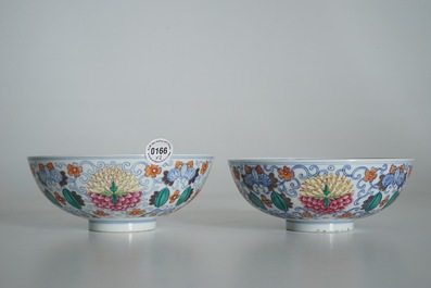 A pair of Chinese doucai bowls with floral famille rose medallions, 4-character mark, 19/20th C.